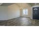 Spacious living room with a chandelier, light walls, and luxury vinyl flooring at 5800 W Kesler St, Chandler, AZ 85226