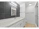 Bathroom featuring a modern vanity with granite counters and a shower at 6105 N 12Th Way, Phoenix, AZ 85014