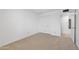 Clean bedroom with neutral carpet, a closet, and an adjacent bathroom at 6105 N 12Th Way, Phoenix, AZ 85014