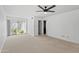 Bright bedroom with plush carpeting and sliding glass doors leading to a private patio at 6105 N 12Th Way, Phoenix, AZ 85014