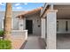 Detailed view of home entrance, featuring a tiled roof and textured columns at 6105 N 12Th Way, Phoenix, AZ 85014