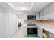Well-equipped kitchen featuring stainless steel appliances, tile backsplash, and ample cabinet space at 6105 N 12Th Way, Phoenix, AZ 85014