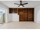 Cozy living room features ample built-in shelving and sliding glass doors to the backyard at 6105 N 12Th Way, Phoenix, AZ 85014
