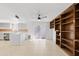 Spacious living room features modern ceiling fan and built-in shelving, creating a stylish and comfortable atmosphere at 6105 N 12Th Way, Phoenix, AZ 85014