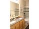 Bright bathroom featuring a double sink vanity, large mirror, and tiled shower/tub combination at 7024 W Tether Trl, Peoria, AZ 85383
