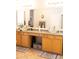 Bathroom features double sinks with granite countertops, and light wood cabinets at 7024 W Tether Trl, Peoria, AZ 85383