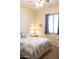 Comfortable bedroom with a ceiling fan, natural light, and neutral decor at 7024 W Tether Trl, Peoria, AZ 85383