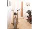 Exercise room with an exercise bike, elliptical, and weights at 7024 W Tether Trl, Peoria, AZ 85383
