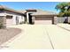 Spacious single Gathering home with three car garage and desert landscaping at 7024 W Tether Trl, Peoria, AZ 85383