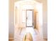 Bright foyer with a decorative tile floor and an open doorway to another room at 7024 W Tether Trl, Peoria, AZ 85383