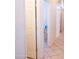 Hallway with open doors and a view into another room at 7024 W Tether Trl, Peoria, AZ 85383