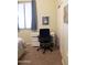 Functional home office area with a desk, chair, and natural light at 7024 W Tether Trl, Peoria, AZ 85383