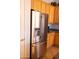 Kitchen with stainless steel refrigerator and light wood cabinets at 7024 W Tether Trl, Peoria, AZ 85383