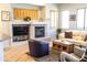 Spacious living area with fireplace, entertainment center, and tile flooring at 7024 W Tether Trl, Peoria, AZ 85383
