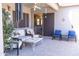Inviting covered patio with comfortable seating and stylish decor for outdoor enjoyment at 7024 W Tether Trl, Peoria, AZ 85383