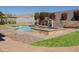 Inviting pool with a waterfall feature and integrated spa, surrounded by well-maintained landscaping at 7024 W Tether Trl, Peoria, AZ 85383