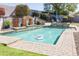 Sparkling pool with a cleaning robot and lush desert landscaping perfect for enjoying the outdoors at 7024 W Tether Trl, Peoria, AZ 85383