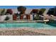 Sparkling pool featuring a decorative wall with greenery, perfect for relaxation and entertaining at 7024 W Tether Trl, Peoria, AZ 85383