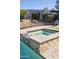 Secluded backyard spa with lush green landscaping providing a private retreat at 7024 W Tether Trl, Peoria, AZ 85383