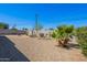 Back yard featuring desert landscaping and a variety of plants at 7526 E Mckinley St, Scottsdale, AZ 85257