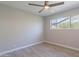 This bedroom offers a large window to let natural light in at 7526 E Mckinley St, Scottsdale, AZ 85257