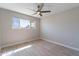 Bedroom with wood-look tile floors, a ceiling fan, and a window view at 7526 E Mckinley St, Scottsdale, AZ 85257