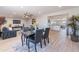 Dining area with modern table and chairs, open to living and kitchen, with natural light at 7526 E Mckinley St, Scottsdale, AZ 85257