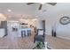 Open living space with view into kitchen, stylish seating, and neutral decor at 7526 E Mckinley St, Scottsdale, AZ 85257