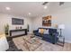 Relaxing living room with contemporary design, flat screen tv, and wood-look flooring at 7526 E Mckinley St, Scottsdale, AZ 85257