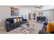 Stylish living area with open layout flowing to dining and kitchen, featuring a comfortable sofa at 7526 E Mckinley St, Scottsdale, AZ 85257