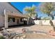 Covered backyard patio looking out at mature landscaping and a rock garden at 770 W Kent Pl, Chandler, AZ 85225