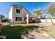 Beautiful backyard with lush lawn, stone patio, mature landscaping, and privacy fence at 770 W Kent Pl, Chandler, AZ 85225