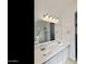 Bathroom features a dual sink vanity with great mirror and lighting at 770 W Kent Pl, Chandler, AZ 85225