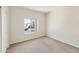 Cozy bedroom featuring a window for natural light and neutral carpeting at 770 W Kent Pl, Chandler, AZ 85225
