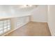 Bright bonus room with carpet floors and unique glass block windows at 770 W Kent Pl, Chandler, AZ 85225