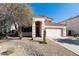 Beige single Gathering home with a well manicured desert landscape and charming front entrance at 770 W Kent Pl, Chandler, AZ 85225