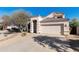 Home exterior featuring desert landscaping, driveway, and attached two-car garage at 770 W Kent Pl, Chandler, AZ 85225