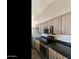 Modern kitchen boasts stainless appliances, granite countertops, and stylish gray cabinetry at 770 W Kent Pl, Chandler, AZ 85225