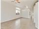 Expansive living room featuring vaulted ceilings, tile flooring, and large arched windows at 770 W Kent Pl, Chandler, AZ 85225