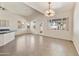 Open living space featuring tile floors, modern light fixtures, and a bar-style kitchen at 770 W Kent Pl, Chandler, AZ 85225