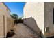 View of the property's side yard showing the wall and gravel area at 770 W Kent Pl, Chandler, AZ 85225