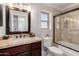 Bathroom with vanity, granite countertops, combination shower and tub at 8807 E Dahlia Dr, Scottsdale, AZ 85260