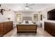 Bright bedroom with a large bed, natural wood dresser, and neutral decor at 8807 E Dahlia Dr, Scottsdale, AZ 85260