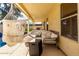 Cozy outdoor patio area with comfortable seating, hammock, and string lights for relaxing evenings at 8807 E Dahlia Dr, Scottsdale, AZ 85260