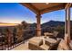 Covered balcony with seating offers stunning mountain views and desert landscape at 9920 E Honey Mesquite Dr # 155, Scottsdale, AZ 85262