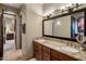 Spacious bathroom with double vanity, granite countertops, and wood cabinets at 9920 E Honey Mesquite Dr # 155, Scottsdale, AZ 85262