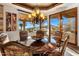 Charming dining room with a decorative chandelier and views of the outdoor scenery at 9920 E Honey Mesquite Dr # 155, Scottsdale, AZ 85262