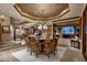 Elegant dining room featuring a decorative ceiling and open access to the living areas at 9920 E Honey Mesquite Dr # 155, Scottsdale, AZ 85262