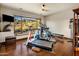 Light-filled exercise room featuring hardwood floors, gym equipment, and scenic views at 9920 E Honey Mesquite Dr # 155, Scottsdale, AZ 85262