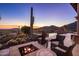Scenic outdoor firepit with comfortable seating and captivating desert views at 9920 E Honey Mesquite Dr # 155, Scottsdale, AZ 85262